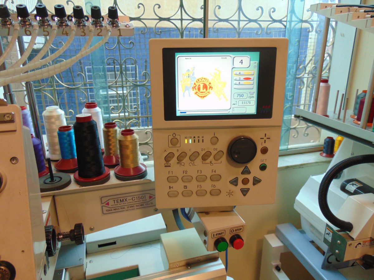 Tajima embroidery machine control panel showing the loaded design